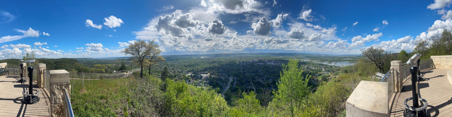 A panorama photo showing the greenery and blue skies of La Crosse