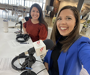 Christina takes a selfie of her and Leslie sitting by microphones