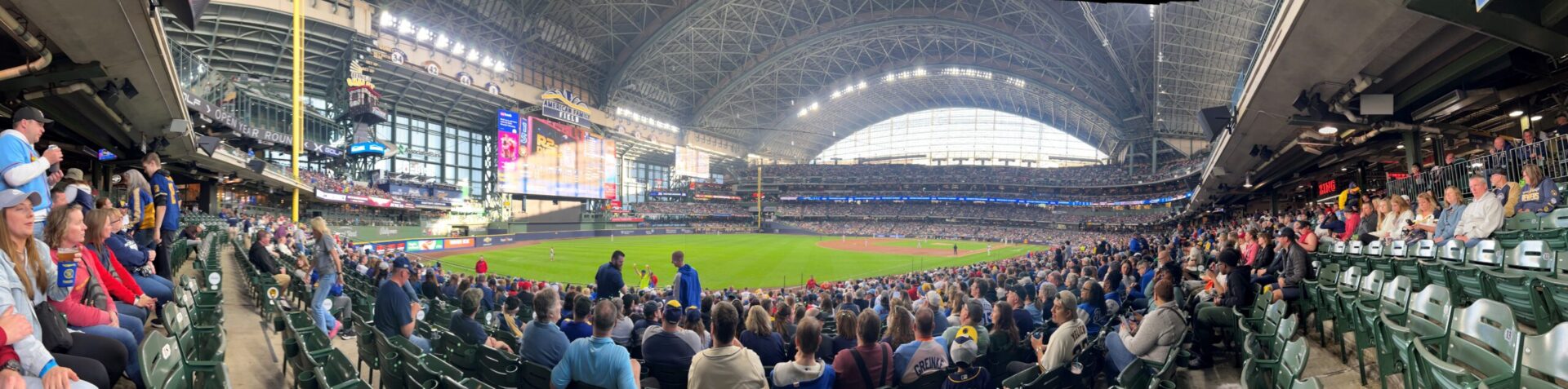 A panorama photo of a baseball game at American Family Field