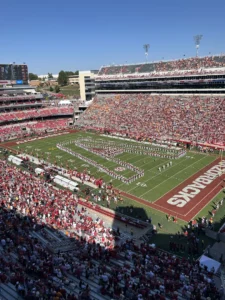 Razorback Stadium before the game. The Razorback Marching Band forms a giant “A” through which the Razorbacks will enter the field.